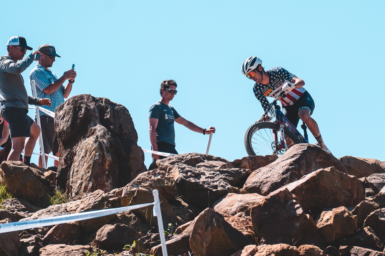 US Pro Cup racer navigating a technical rock section